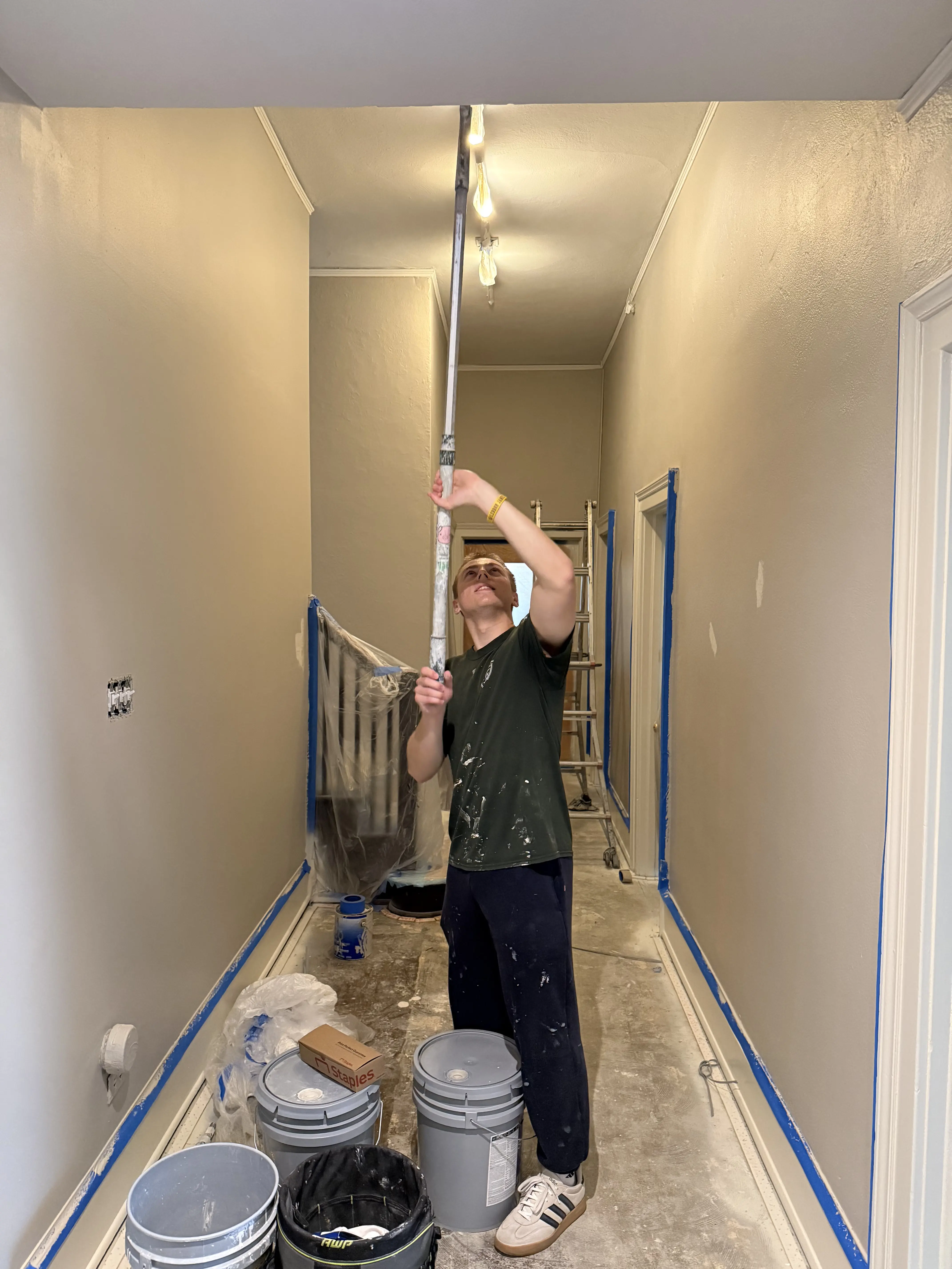 Ann Arbor Painting crew member preparing a home painting project